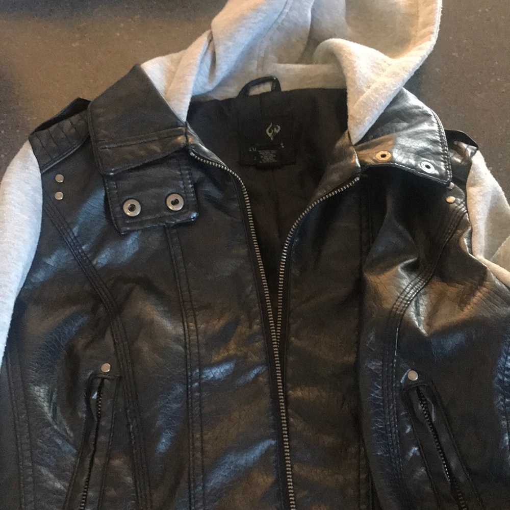 Leather  jacket with sweater sleeves